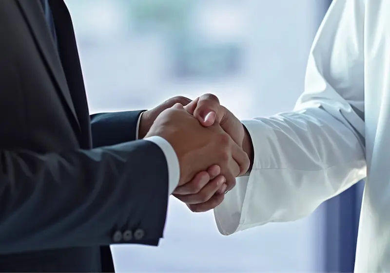 Business partnership handshake